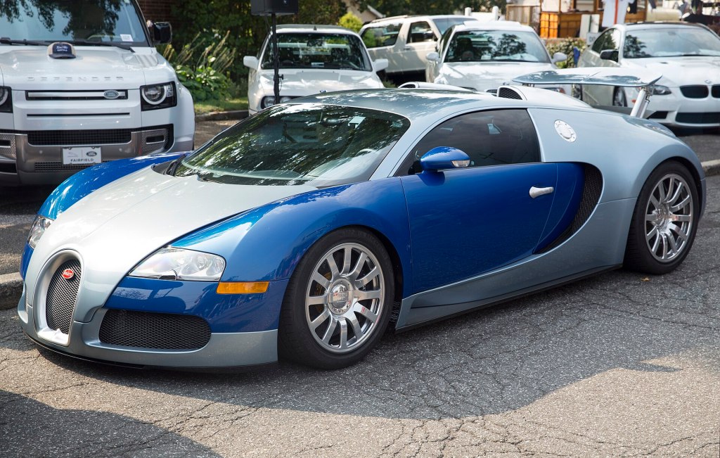 A 2008 Bugatti Veyron 16.4 in blue and silver, front left view